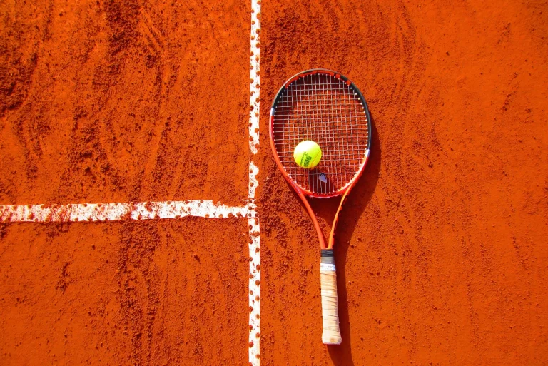 Understanding Tennis Court Surfaces: How to Play on Grass, Clay, and Hard Courts - tennis court surfaces